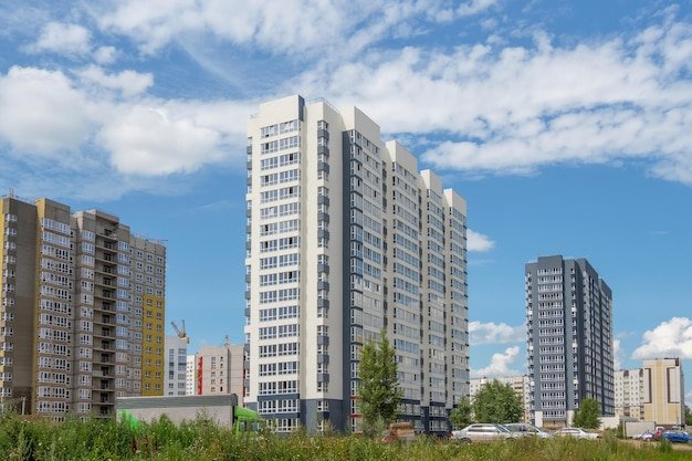 modern-construction-new-neighborhood-beautiful-new-buildings-colored-wall-background-blue-cloudy-sky-copy-space_158388-8685